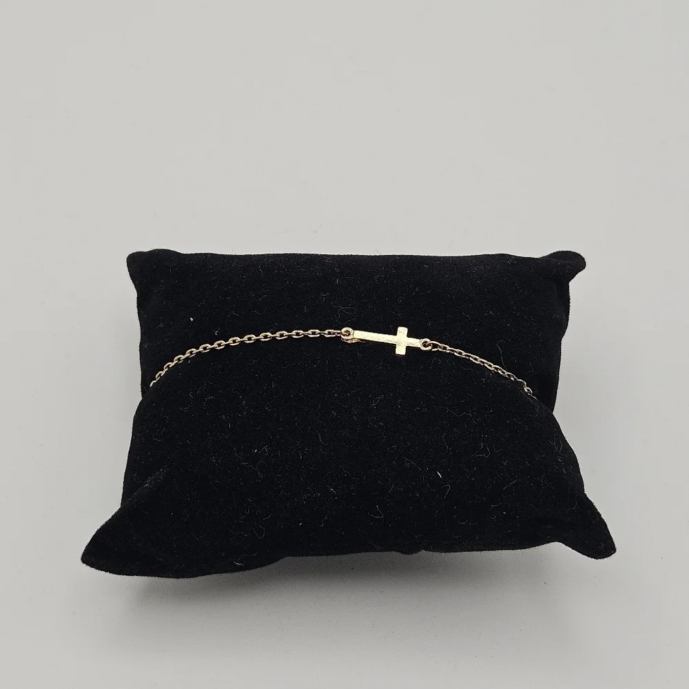 gold tone chain bracelet with cross charm